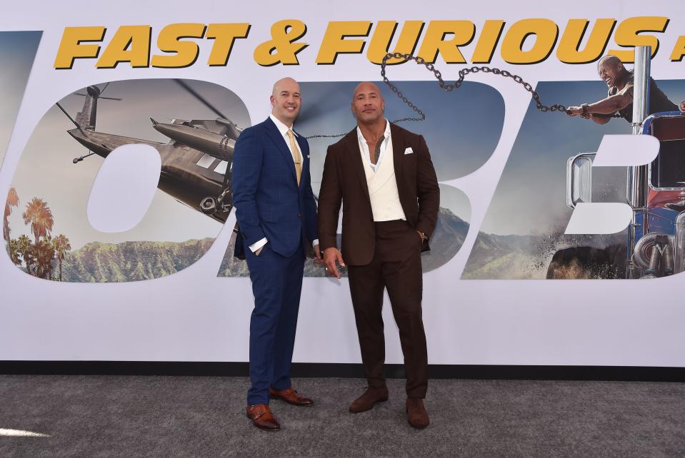 US actor Dwayne Johnson (R) and producer Hiram Garcia (L) arrive for the World premiere of  "Fast & Furious presents Hobbs & Shaw," at the Dolby Theatre in Hollywood, California, July 13, 2019. (Photo by Chris Delmas / AFP)        (Photo credit should read CHRIS DELMAS/AFP via Getty Images)