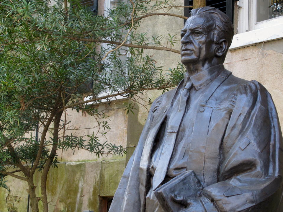 FILE - In this April 3, 2014, file photo, a statue of U.S. District Judge Waties Waring, one of three federal judges to hear a key school desegregation case from South Carolina in 1951, stands outside the federal courthouse in Charleston, S.C. U.S. Attorney Gen. Eric Holder visited Charleston on Friday, April 11, 2014 to help dedicate the statue. (AP Photo/Bruce Smith, file)