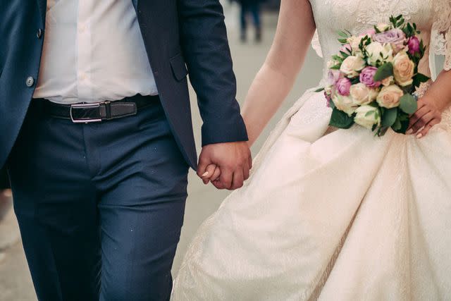 <p>Getty</p> A stock image of a bride and groom