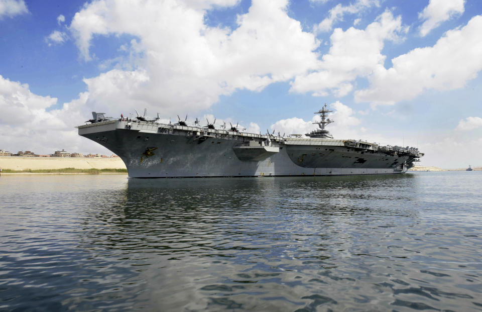 The USS Abraham Lincoln sails south in the Suez canal near Ismailia, Thursday, May 9, 2019. The White House said Wednesday it dispatched the aircraft carrier and B-52 bombers to the Persian Gulf over what it described as a new threat from Iran. (Suez Canal Authority via AP)