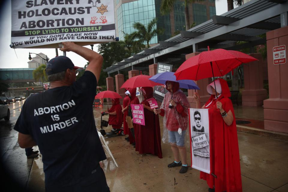 Supporters and opponents of abortion rights were present at a protest in downtown Fort Myers on Tuesday, May 3, 2022. Members for abortion rights held the protest in response to a leaked draft opinion from the Supreme Court seeking to overturn Roe v. Wade. 