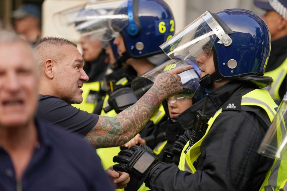 A man points at a police officer (Jordan Pettitt/PA Wire)