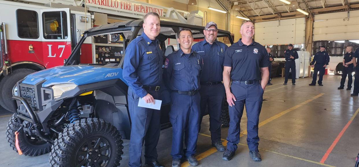 Amarillo Fire Chief Jason Mays stands with members of the department's wildland paramedic team with the new utility terrain vehicle Tuesday at Fire Station 7 in east Amarillo.