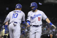 Los Angeles Dodgers' AJ Pollock celebrates with Justin Turner (10) after hitting a two-run home run against the Arizona Diamondbacks in the second inning during a baseball game, Friday, Sept. 24, 2021, in Phoenix. (AP Photo/Rick Scuteri)