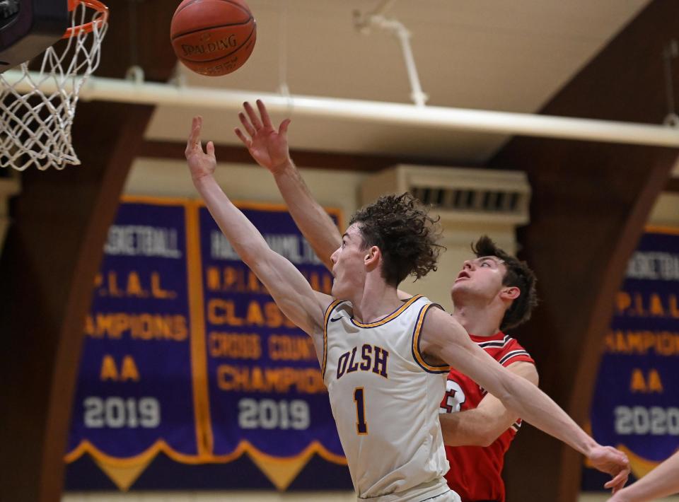 OLSH's Rocco Spadafora shoots in front of Avonworth's Jordan Kolenda  during Monday's game at OLSH.