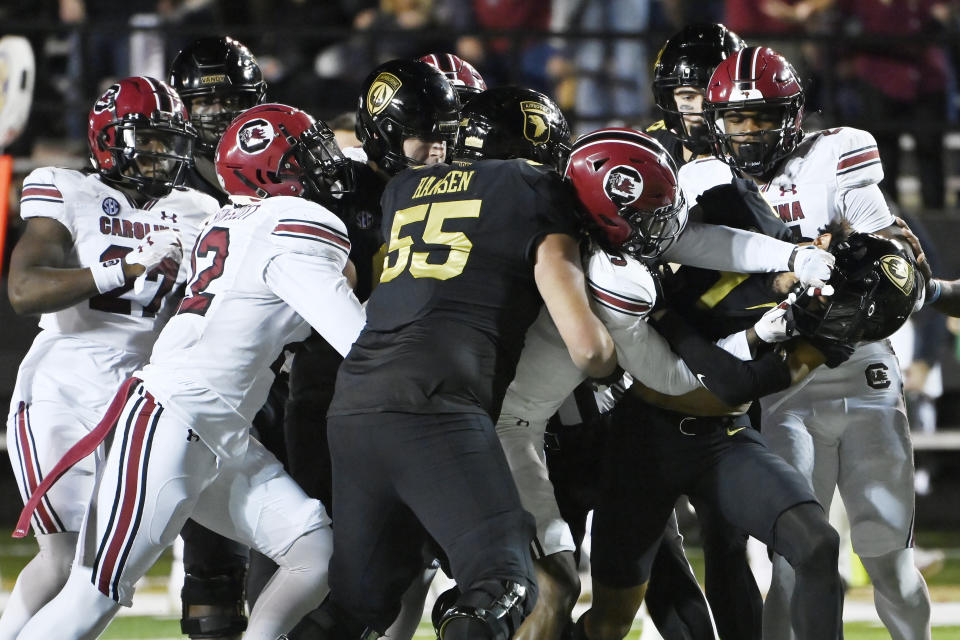 South Carolina defensive back Cam Smith (9) scuffles with Vanderbilt wide receiver Will Sheppard, front right, after South Carolina hit quarterback A.J. Swann on a pass play in the first half of an NCAA college football game Saturday, Nov. 5, 2022, in Nashville, Tenn. (AP Photo/Mark Zaleski)