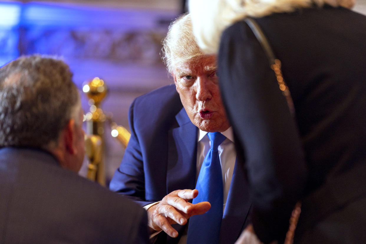 Former President Donald Trump speaks to guests at Mar-a-lago  (Andrew Harnik / AP)