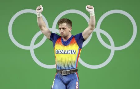 2016 Rio Olympics - Weightlifting - Final - Men's 85kg - Riocentro - Pavilion 2 - Rio de Janeiro, Brazil - 12/08/2016. Gabriel Sincraian (ROU) of Romania celebrates. REUTERS/Stoyan Nenov