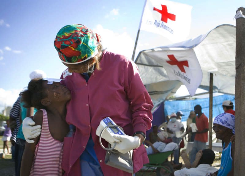 Red Cross volunteer Beatrice Abbot hugs Samantha Eskvowitz in Port-au-Prince, Haiti on January 16, 2010. Clara Barton founded the Red Cross on this day in 1881. Photo by Talia Frenkel/American Red Cross/UPI