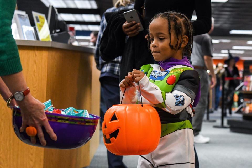 Jacob Lively eyes the candy bowl at the Wicomico Public Library's Halloween parade for kids on Wednesday, Oct 31, 2018.