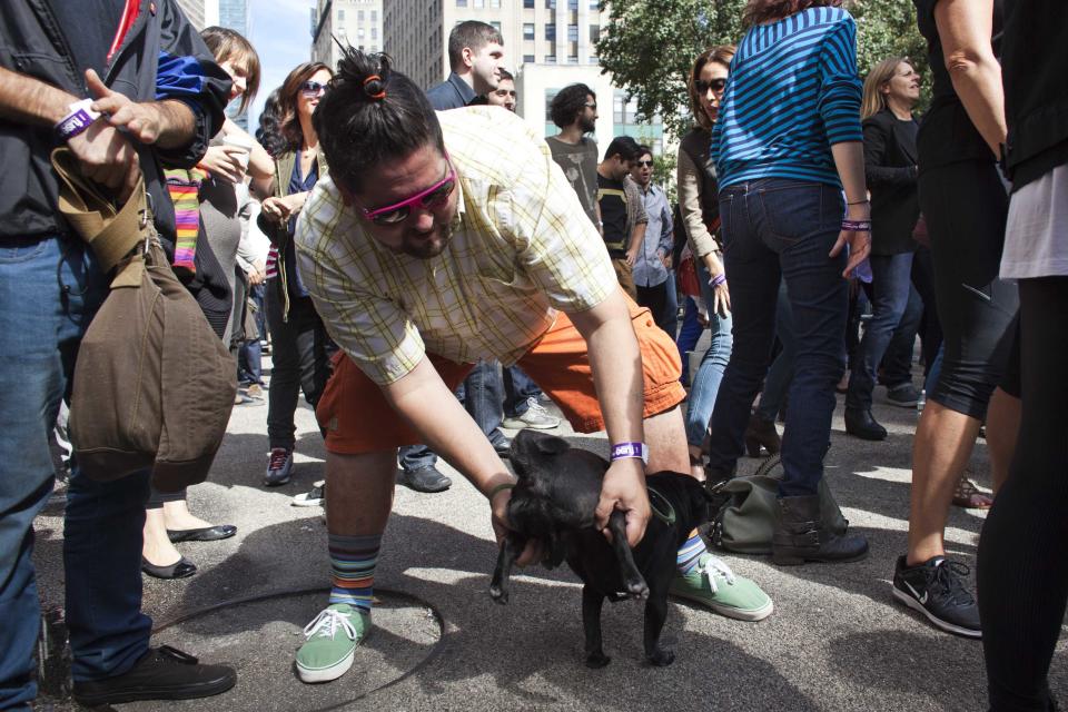 It's not just men and women who take part - even this dog gets in on the act. (Reuters)