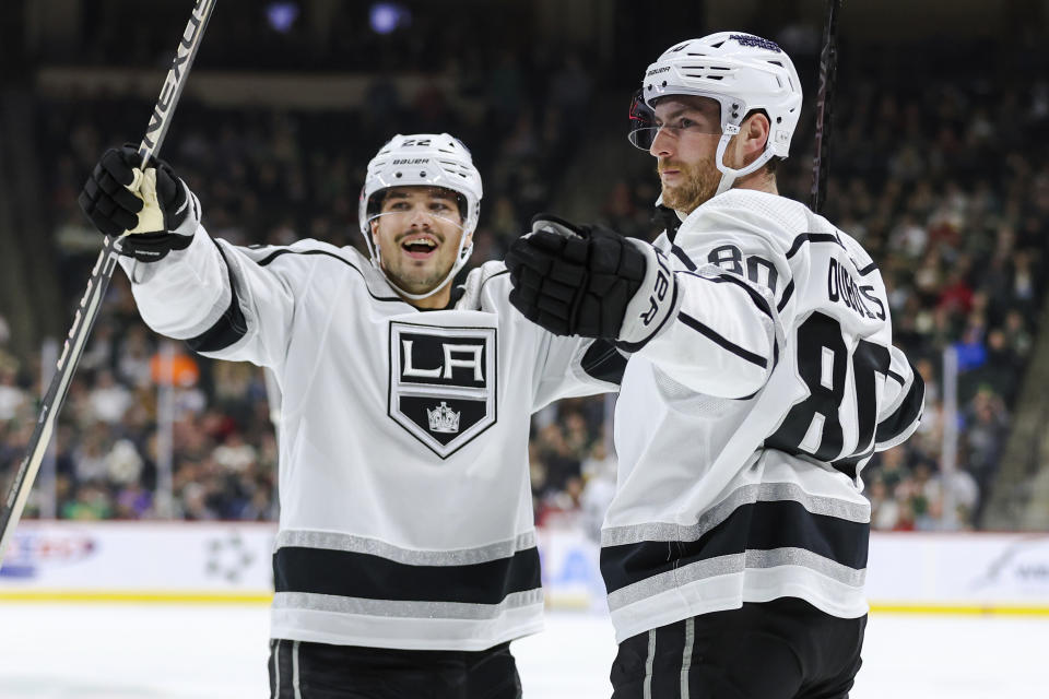 Los Angeles Kings center Pierre-Luc Dubois, right, celebrates after his goal against the Minnesota Wild with teammate left wing Kevin Fiala (22) during the first period of an NHL hockey game Thursday, Oct. 19, 2023, in St. Paul, Minn. (AP Photo/Matt Krohn)