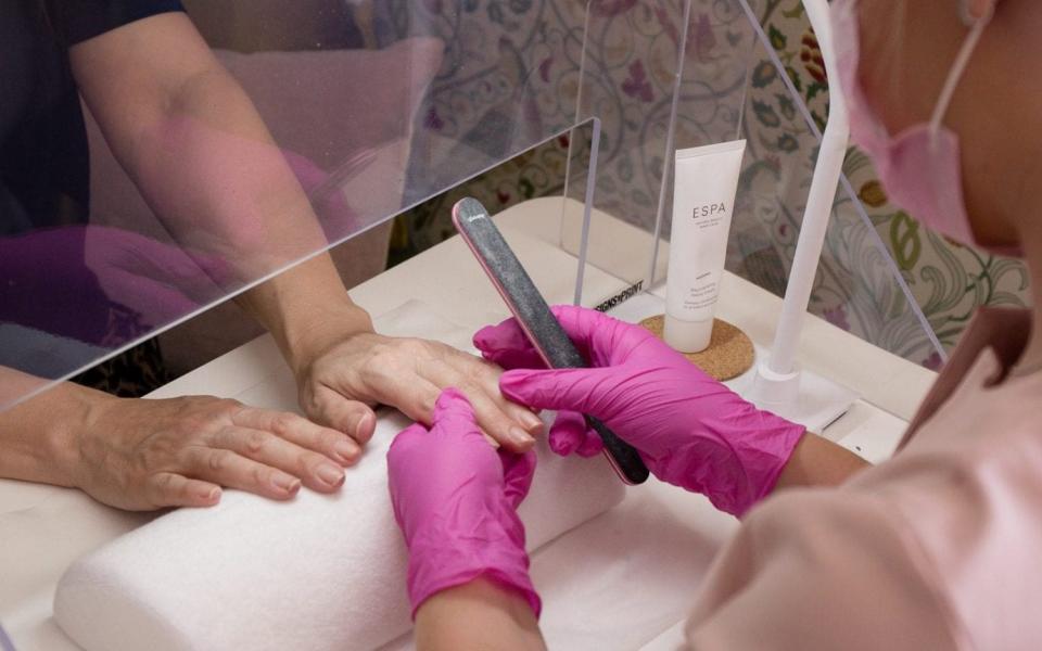 Becci having her nails done at Cecily Spa with the screen in between her and the manicurist - Love Samantha