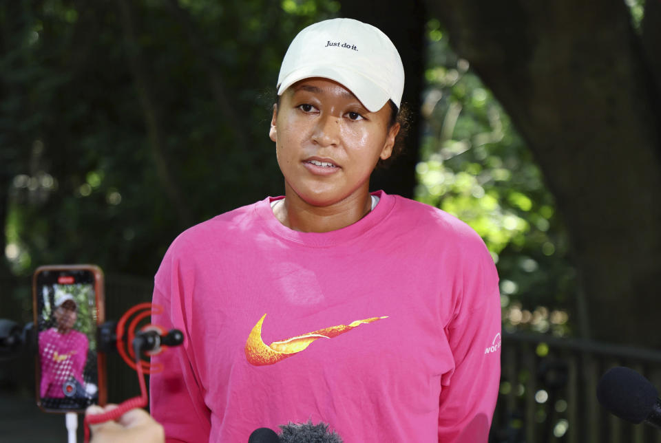 Naomi Osaka of Japan speaks to the media during a visit to the Lone Pine sanctuary ahead of the Brisbane International tennis tournament in Brisbane, Australia, Friday, Dec. 29, 2023. (AP Photo/Tertius Pickard)