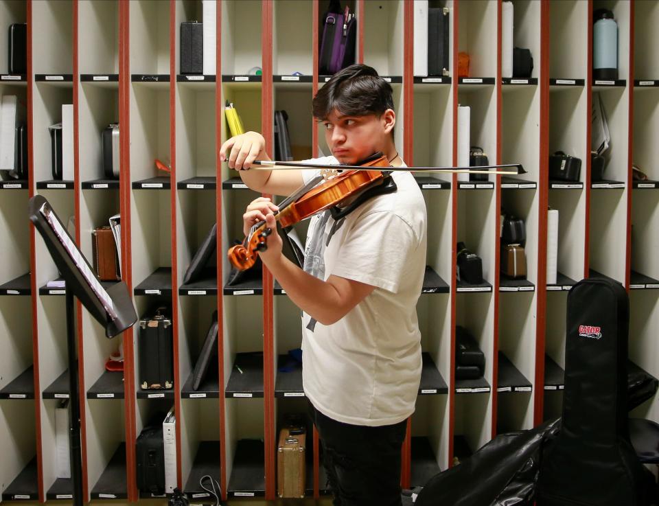 Denison eighth-grade violinist Hariz De Paz works on his technique during mariachi practice at the Denison Middle School.