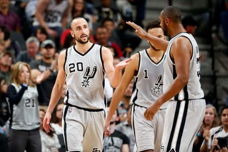 Mar 5, 2016; San Antonio, TX, USA; San Antonio Spurs shooting guard Manu Ginobili (20) celebrates with teammates after making a basket while being fouled against the Sacramento Kings during the second half at AT&T Center. Mandatory Credit: Soobum Im-USA TODAY Sports