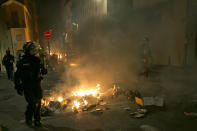 French riot police take positions in the city center during a yellow vest demonstration in Marseille, southern France, Saturday, Jan. 12, 2019. The French Interior Ministry says about 32,000 people have turned out in yellow vest demonstrations across France, including 8,000 in Paris, where scuffles broke out between protesters and police. (AP Photo/Claude Paris)