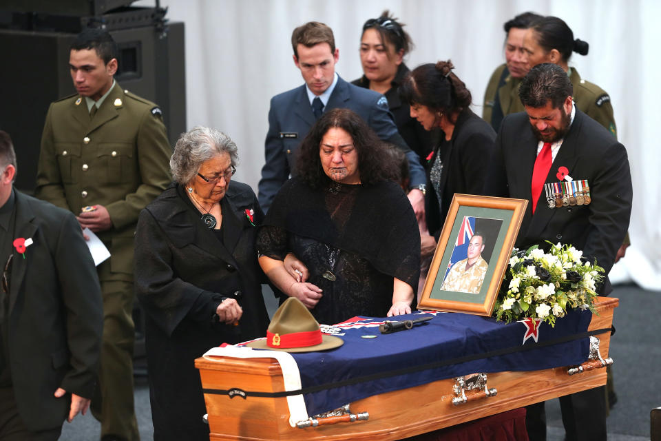CHRISTCHURCH, NEW ZEALAND - AUGUST 25: Family members of Corporal Luke Tamatea pay their respect during a combined memorial service for fallen soldiers Corporal Luke Tamatea, Lance Corporal Jacinda Baker and Private Richard Harris at Burnham Military Camp on August 25, 2012 in Christchurch, New Zealand. The three fallen New Zealand soldiers were fatally wounded in action on August 4, 2012, in the Bayman Province in Afghanistan. (Photo by Martin Hunter/Getty Images)