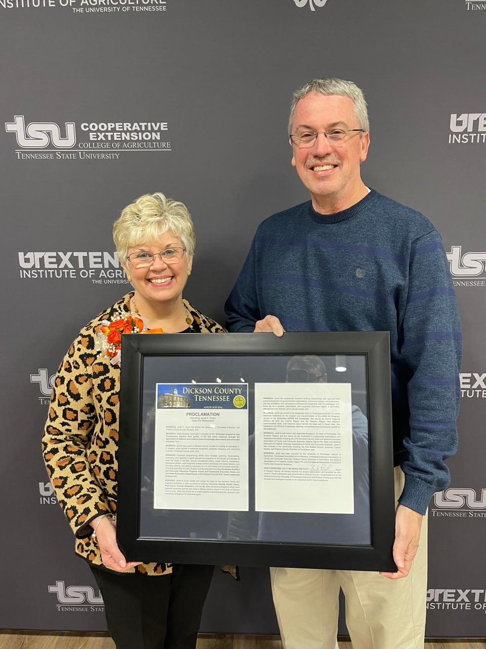 Janet Cluck receiving a proclamation from Dickson County Mayor Bob Rial.