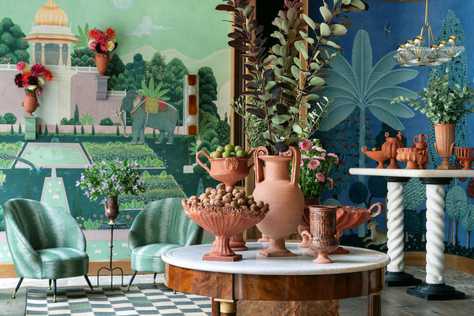 A selection of vessels by Frances Palmer alongside de Gournay’s hand-painted Mahal Garden (left) and Malwa wallpapers