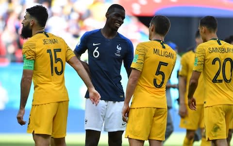 France's midfielder Paul Pogba (C) chats with Australia's midfielder Mile Jedinak (L) and Australia's defender Mark Milligan at the end of the Russia 2018 World Cup Group C football match between France and Australia at the Kazan Arena in Kazan on June 16, 2018 - Credit: AFP