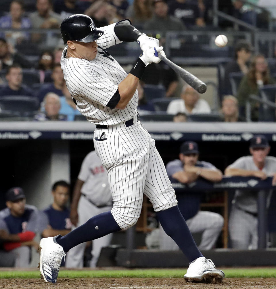 New York Yankees' Aaron Judge singles to right field off Boston Red Sox relief pitcher Joe Kelly during the sixth inning of a baseball game Wednesday, Sept. 19, 2018, in New York. (AP Photo/Julio Cortez)