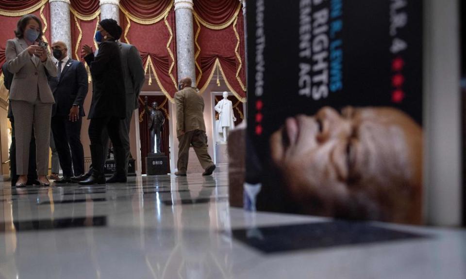 Members of the Congressional Black caucus, and others talk in Statuary Hall after speaking to the press outside the Senate about voting rights legislation on Capitol Hill.