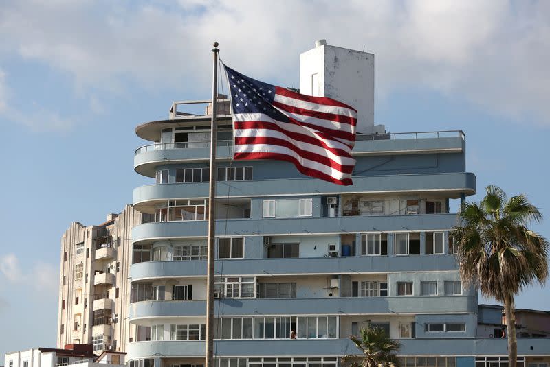 The U.S. flag is seen in front of an apartment building, outside the embassy of the United States in Havana