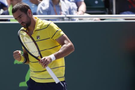 Mar 25, 2018; Key Biscayne, FL, USA; Marin Cilic of Croatia gestures after winning a point against Vasek Pospisil of Canada (not pictured) on day six of the Miami Open at Tennis Center at Crandon Park. Cilic won 7-5. 7-6(4). Mandatory Credit: Geoff Burke-USA TODAY Sports