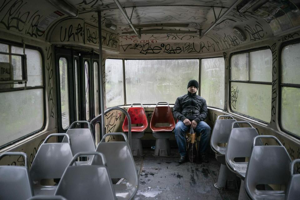 In this photo taken on Monday, April 15, 2019, a man sits in an empty tram in Kryvyi Rih, eastern Ukraine. Residents of the industrial city complain about a low standard of living and soaring utilities bills. Many in the city support Volodymyr Zelenskiy, an actor and comedian from the city, in the runoff election on Sunday, April 21, against President Petro Poroshenko. (AP Photo/Evgeniy Maloletka)