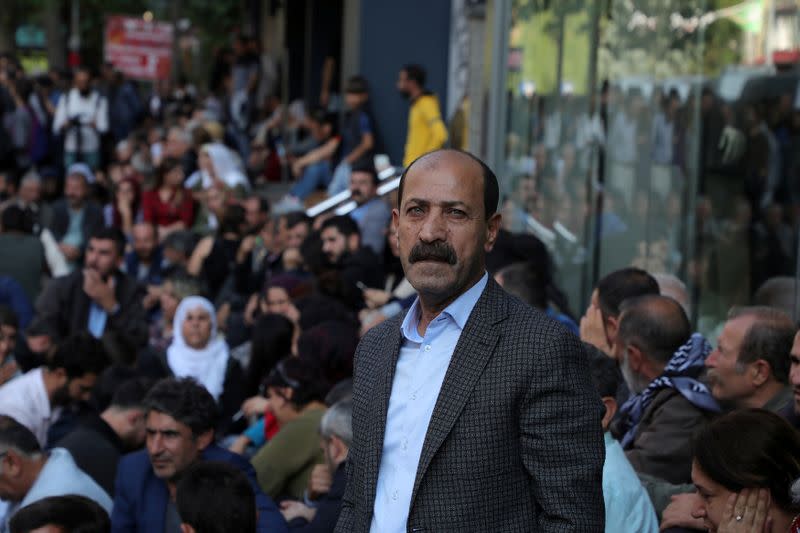 FILE PHOTO: Pro-Kurdish lawmaker Farisogullari takes part in a protest against the detention of their local politicians in Diyarbakir