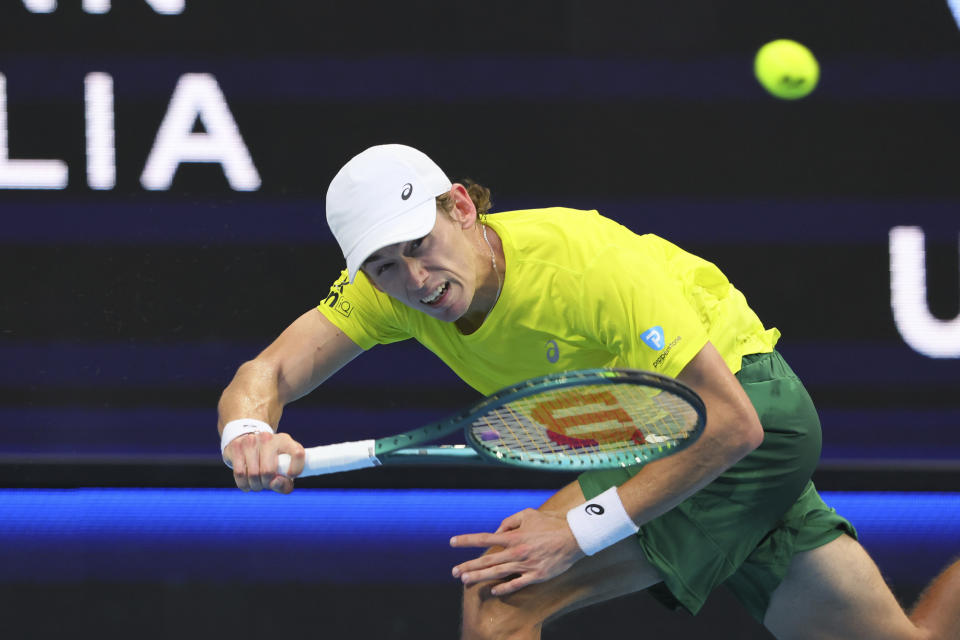 Alex de Minaur of Australia hits a return to Taylor Fritz of the United States during the United Cup tennis tournament in Perth, Australia, Monday, Jan. 1, 2024. (AP Photo/Trevor Collens)