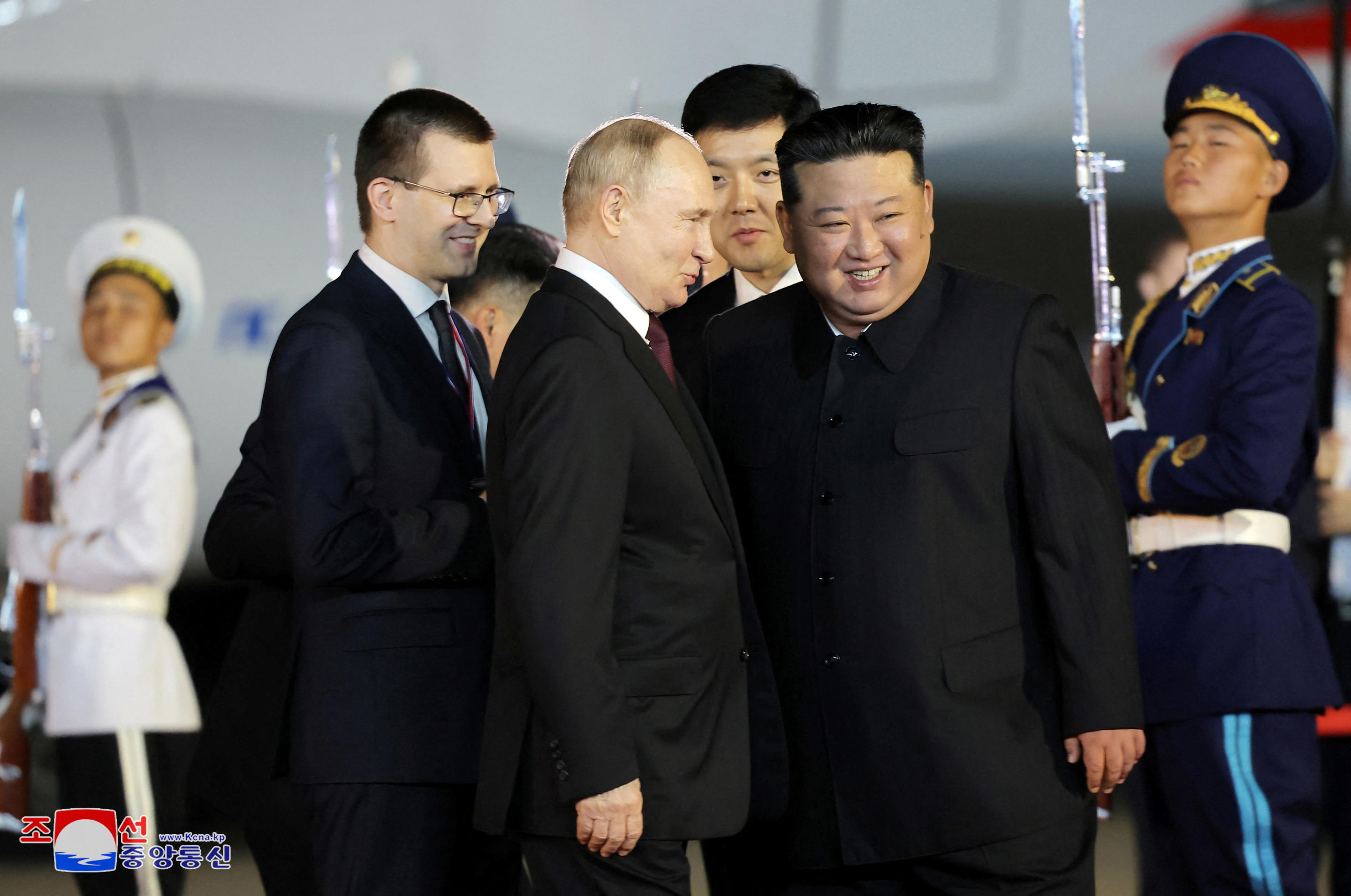 Russian President Vladimir Putin is welcomed by North Korean leader Kim Jong Un upon his arrival at an airport in Pyongyang, North Korea, in this image released by the Korean Central News Agency June 19, 2024. (KCNA via Reuters)