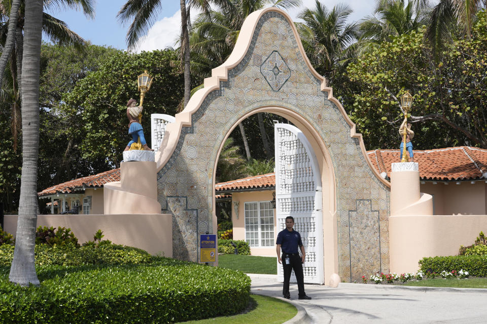 A security guard stands near an entrance to Mar-a-Lago, as former President Donald Trump is planning to meet Hungarian Prime Minister Victor Orban, Friday, March 8, 2024, in Palm Beach, Fla. (AP Photo/Marta Lavandier)