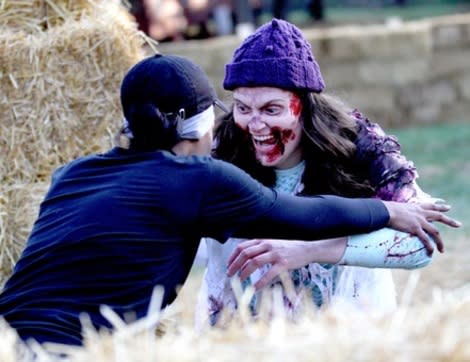 A runner competes in a zombie-infested obstacle course.