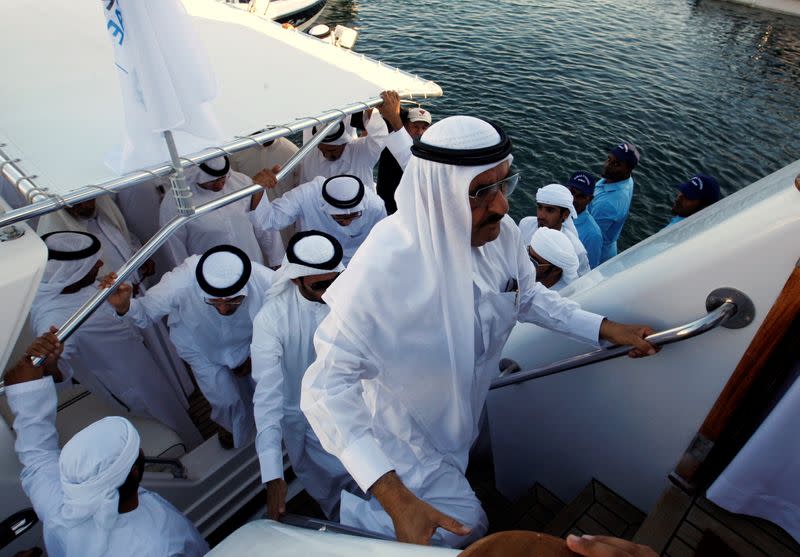 FILE PHOTO: United Arab Emirates Finance Minister Sheikh Hamdan bin Rashid al-Maktoum boards the royal yacht Al Fahedi