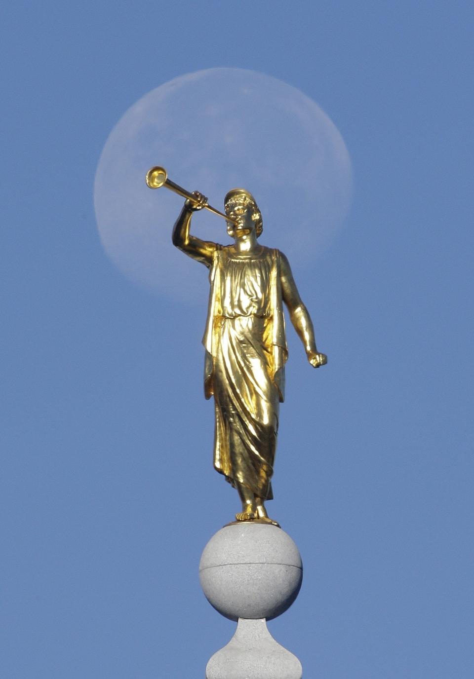 FILE - The angel Moroni statue sits atop the Salt Lake Temple of The Church of Jesus Christ of Latter-day Saints at Temple Square on Sept. 11, 2014, in Salt Lake City. The Church of Jesus Christ of Latter-day Saints on Tuesday, Nov. 15, 2022, came out in support of The Respect for Marriage Act under consideration in Congress after years of opposing recognition of same-sex marriage. (AP Photo/Rick Bowmer, File)
