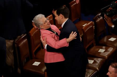 U.S. Republican presidential candidate Senator Marco Rubio embraces Rep. Virginia Foxx as they wait on the floor of the House of Representatives before the start of U.S. President Barack Obama's State of the Union address to a joint session of Congress in Washington, January 12, 2016. REUTERS/Jonathan Ernst -