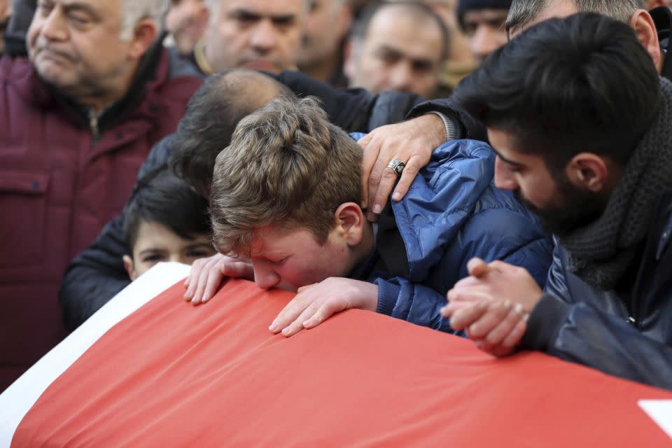 Family members and friends mourn as they attend funeral prayers for Ayhan Akin, one of the victims of the nightclub attack. Photo: AP