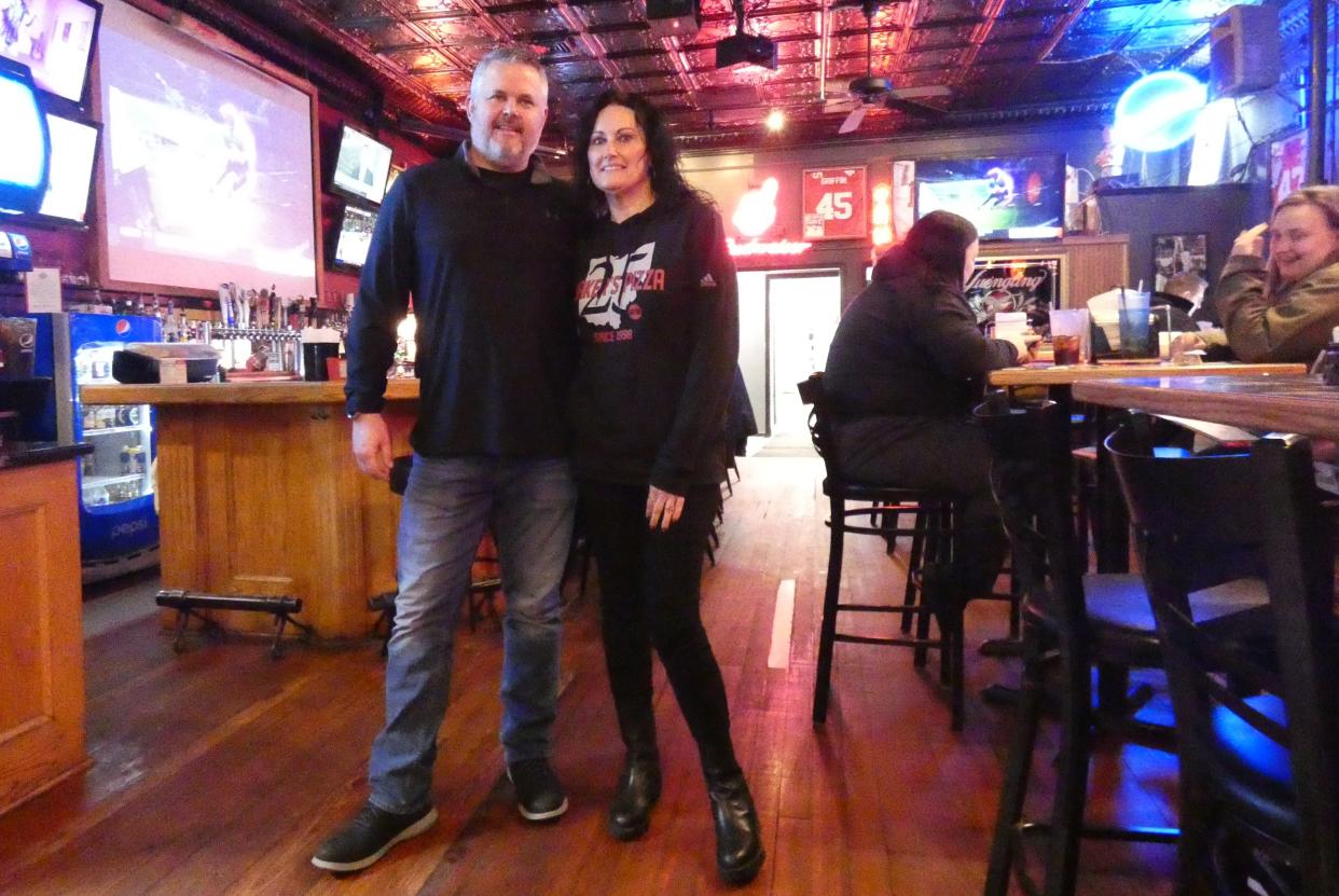 Breck Baker, left, and Connie Smith are co-owners of Baker's Pizza, which will celebrate its 25th anniversary this month.