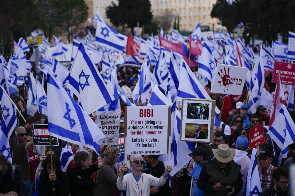 Israelis protest against Prime Minister Benjamin Netanyahu's judicial overhaul plan outside the parliament in Jerusalem, Monday, March 27, 2023. (AP Photo/Ariel Schalit)