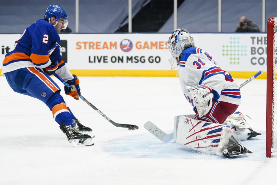 New York Rangers goaltender Igor Shesterkin (31) stops a shot on goal by New York Islanders' Nick Leddy (2) during the second period of an NHL hockey game Sunday, April 11, 2021, in Uniondale, N.Y. (AP Photo/Frank Franklin II)