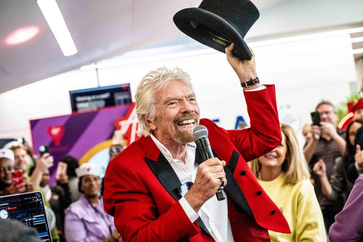 Billionaire Sir Richard Branson Surprises Entire Delta Flight with a Free  Cruise on Virgin Voyages' Newest Ship