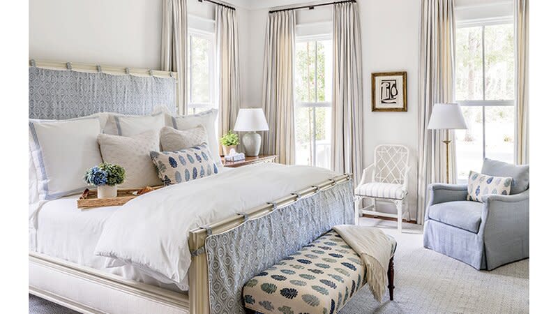 farmhouse bedroom with drapes and large windows