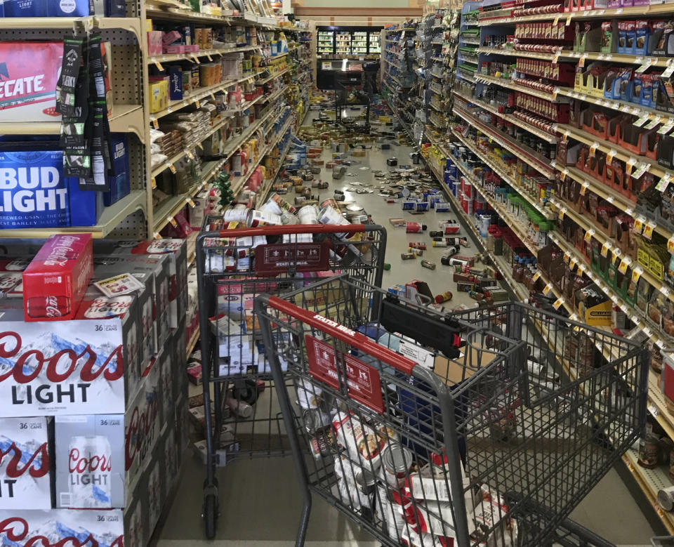 In this photo provided by Adam Graehl, food and other merchandise lies on the floor at the Stater Bros. on China Lake Blvd., after an earthquake, Thursday, July 4, 2019, in Ridgecrest, Calif. The strongest earthquake in 20 years shook a large swath of Southern California and parts of Nevada on Thursday, rattling nerves on the July 4th holiday and causing injuries and damage in a town near the epicenter, followed by a swarm of ongoing aftershocks. (Adam Graehl via AP)