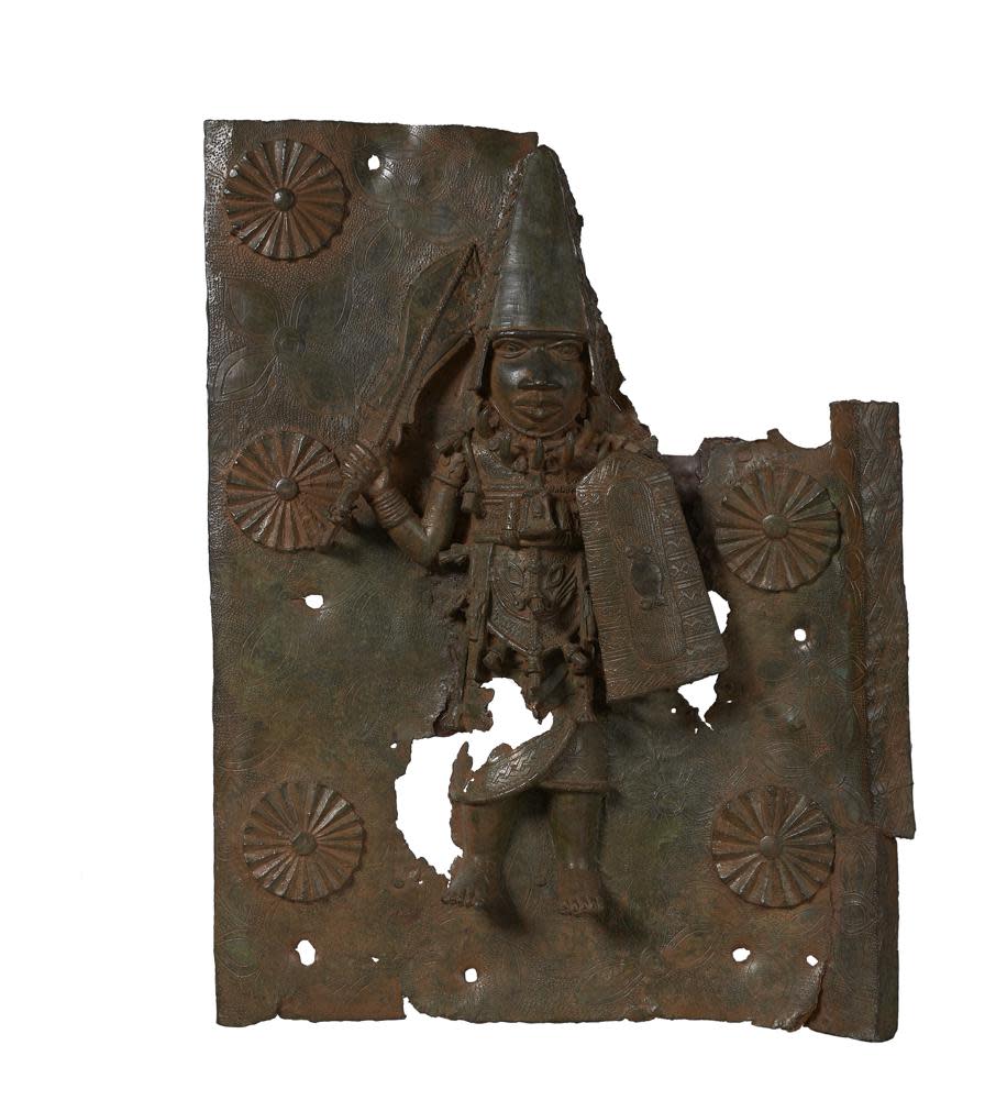 This handout photo provided by Horniman Museum and Gardens shows a brass plaque depicting Agban, the Ezomo (Deputy Commander in Chief of the Benin army), towards the end of the reign of Oba Orhogbua (circa 1550-1578) and the start of the reign of Oba Ehengbuda (circa 1578-1608). (Horniman Museum and Gardens via AP)