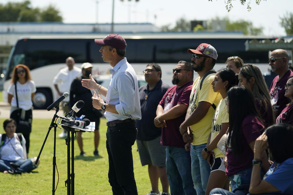 After taking a five-hour bus trip, family of the Uvalde shooting massacre stand with Texas Democratic gubernatorial candidate Beto O'Rourke, center, during a pre-campaign debate news conference, Friday, Sept. 30, 2022, in Edinburg, Texas. O'Rourke will face Gov. Greg Abbott in a debate Friday evening. (AP Photo/Eric Gay)