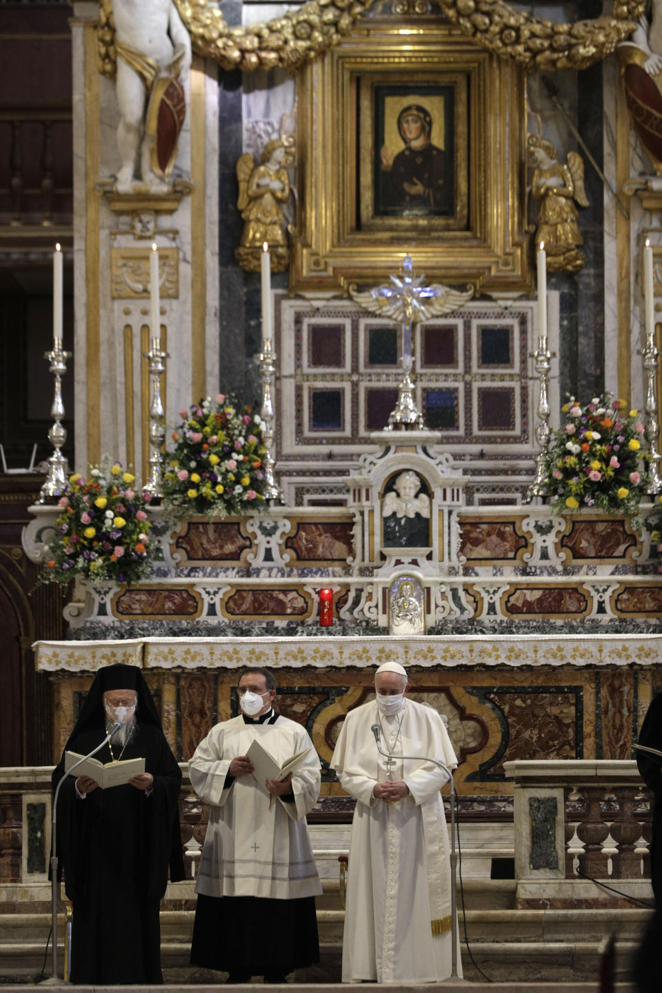 Pope Francis and Bartolomew I, Patriarch of Constantinopolis, attend a inter-religious ceremony for peace in the Basilica of Santa Maria in Aracoeli, in Rome Tuesday, Oct. 20, 2020 (AP Photo/Gregorio Borgia)