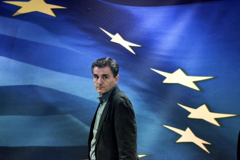 Newly appointed Greek Finance Minister Euclid Tsakalotos arrives for a handover ceremony at the Finance Ministry in Athens on July 6, 2015