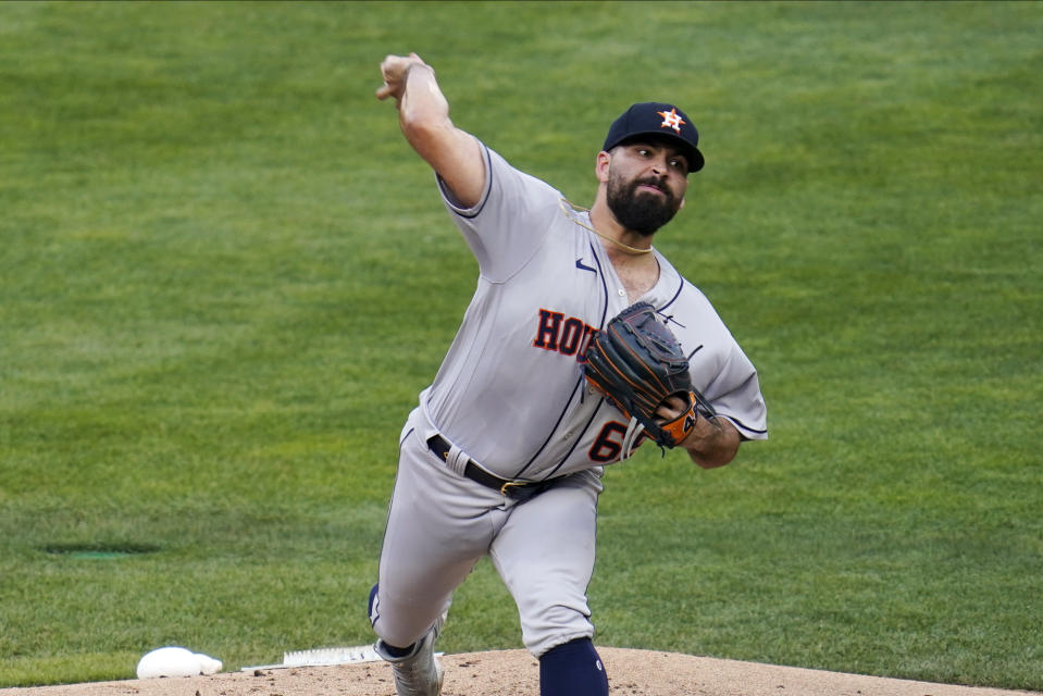 Houston Astros pitcher Jose Urquidy throws against the Minnesota Twins in the first inning of a baseball game, Friday, June 11, 2021, in Minneapolis. (AP Photo/Jim Mone)